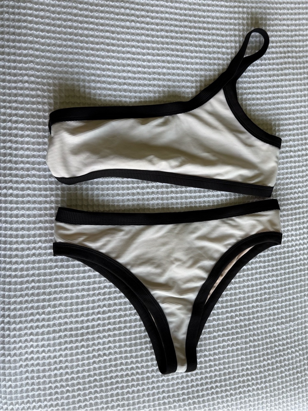 White one shoulder bikini with black lining